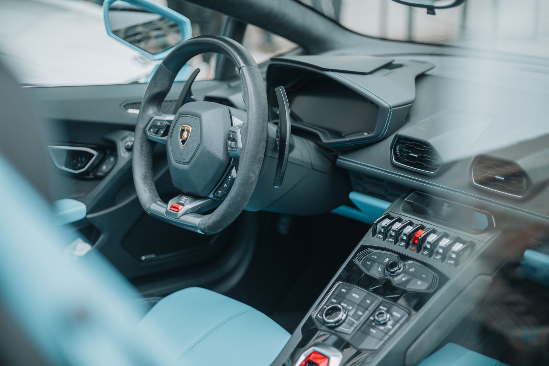 Young driver in a performance hatchback, relevant to black box insurance for young drivers UK