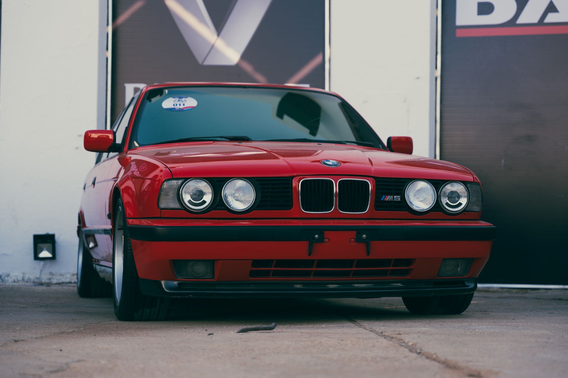 Dark BMW fast diesel estate on a wet UK motorway — fast diesel estate buying guide