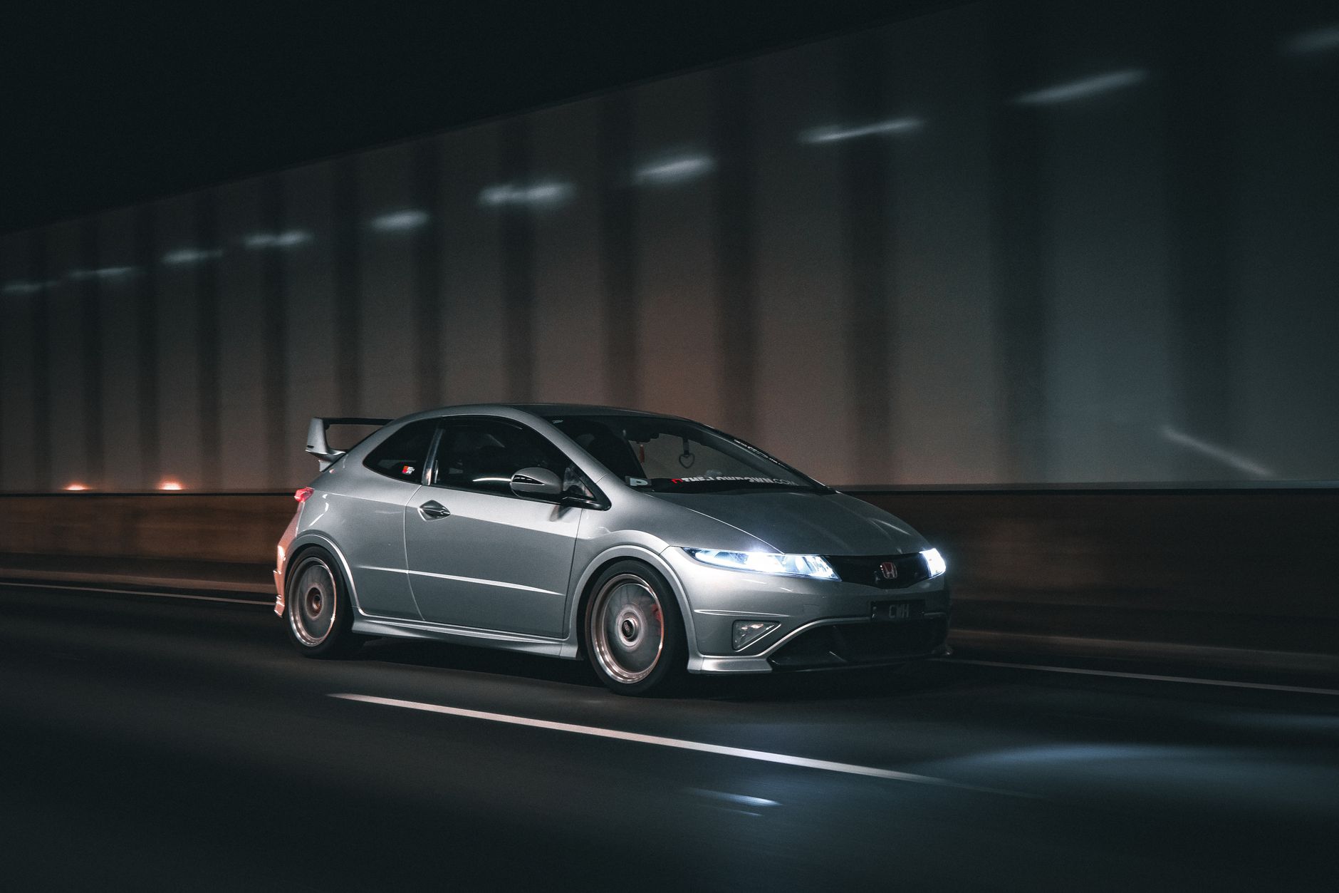 Limited edition hot hatches UK parked at a British motorway services at dusk